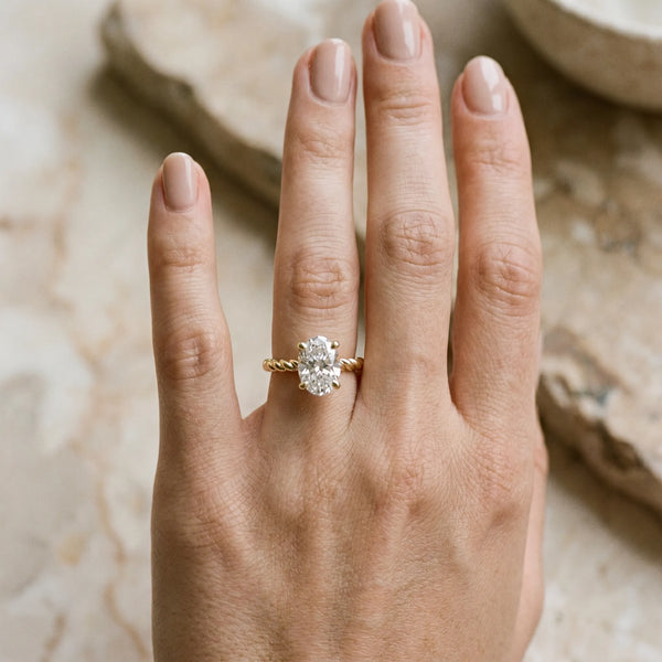 Yellow gold Oval Solitaire Twisted Band 4-Prong Ring
