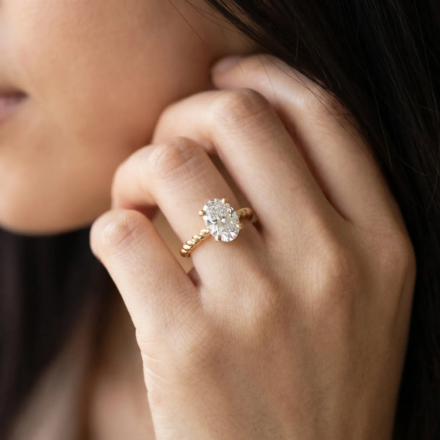 Yellow gold Oval Solitaire Twisted Band 4-Prong Ring