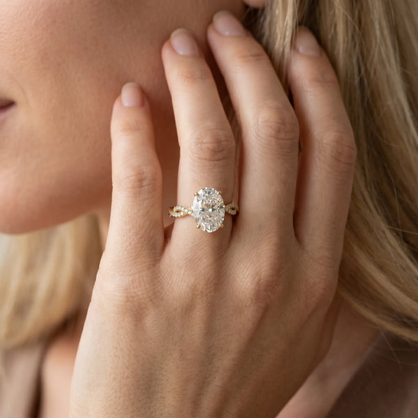 Yellow gold Oval Solitaire Twisted Pave Band with Four-Prong Setting