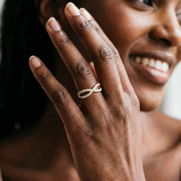 Yellow gold Pavé Round Diamond Infinity Twist Band with Shared Prong Setting