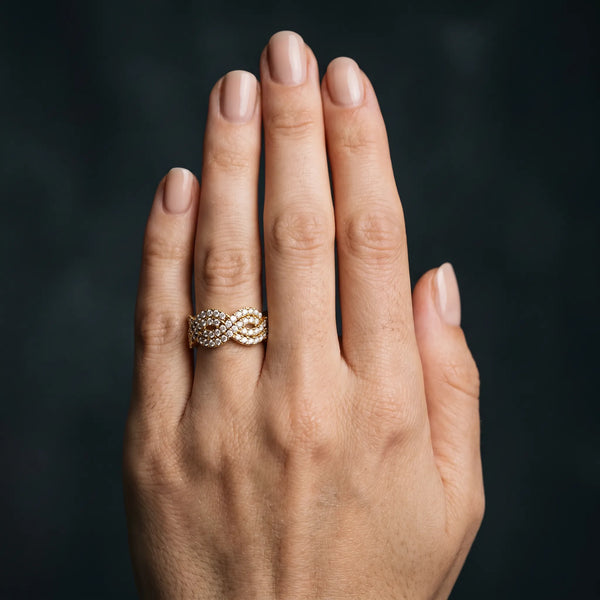 Yellow gold Pavé Round Diamond Infinity Twist Band with Shared Prong Setting