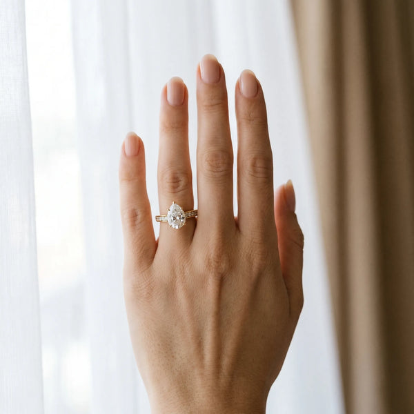 Yellow gold Pear Brilliant Cut Diamond Engagement Ring with Pavé Band and Four-Prong Setting