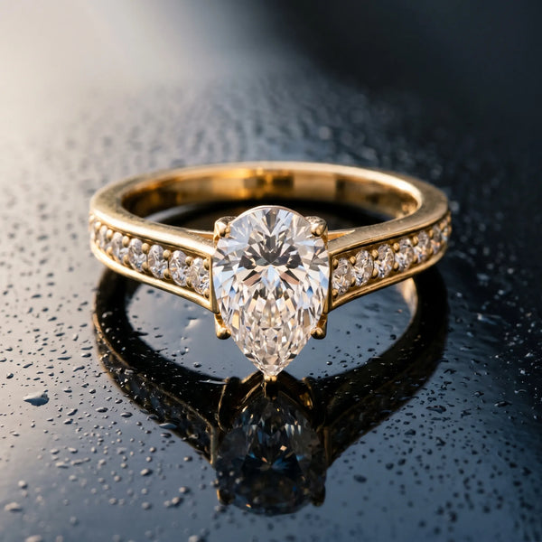 Yellow gold Pear Brilliant Cut Diamond Engagement Ring with Pavé Band and Four-Prong Setting