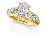 Yellow gold Pear Brilliant Solitaire with Side Stones on a Pave Band and Four-Prong Setting_25