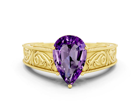 Yellow gold Pear Cut Amethyst Solitaire Ring with Engraved Band and Four-Prong Setting