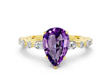 Yellow gold Pear Cut Amethyst Solitaire with Side Stones on a Pavé Band and Four-Prong Setting