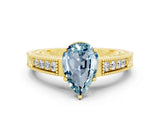 Yellow gold Pear Cut Aquamarine Engagement Ring with Milgrain Channel Set Band and Prong Setting