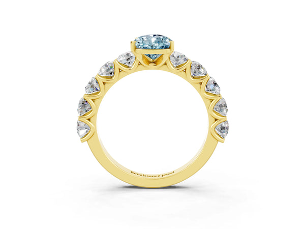 Yellow gold Pear Cut Aquamarine Prong Setting with Side Stones on a Pave Band