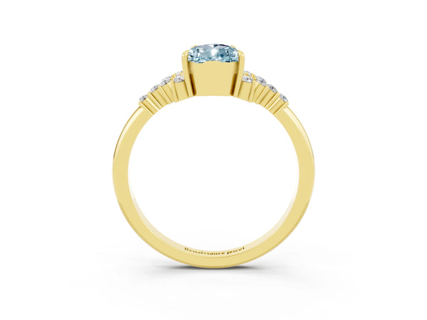 Yellow gold Pear Cut Aquamarine Ring with Side Stones and Four-Prong Setting