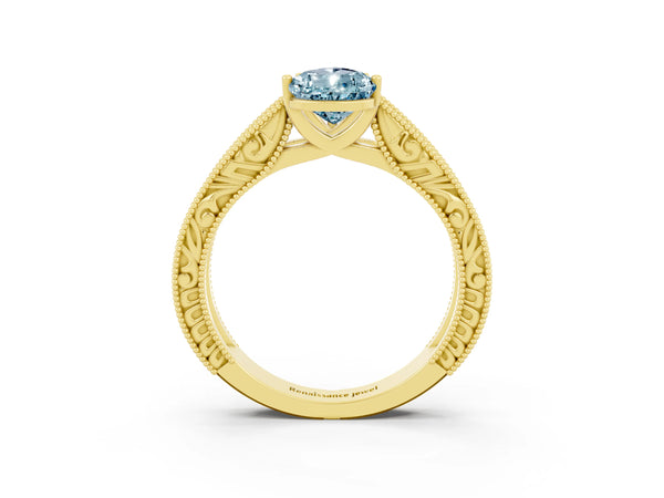 Yellow gold Pear Cut Aquamarine Solitaire Ring with Engraved Band and Four-Prong Setting
