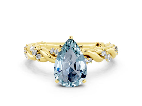 Yellow gold Pear Cut Aquamarine Solitaire Ring with Twisted Band and Pavé Accents