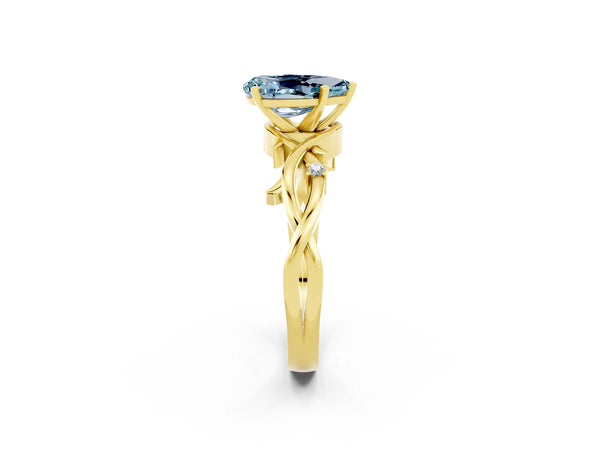 Yellow gold Pear Cut Aquamarine Solitaire Ring with Twisted Band and Prong Setting