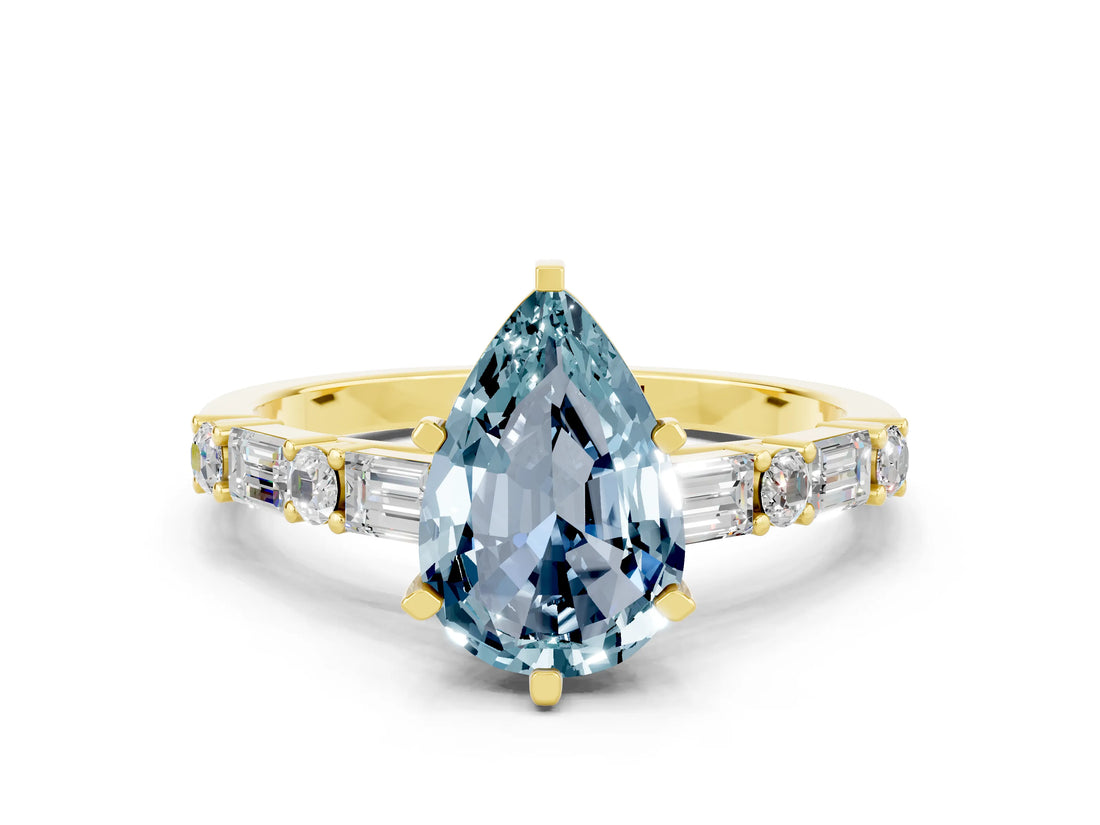 Yellow gold Pear Cut Aquamarine Solitaire with Side Baguettes and Channel Set Band