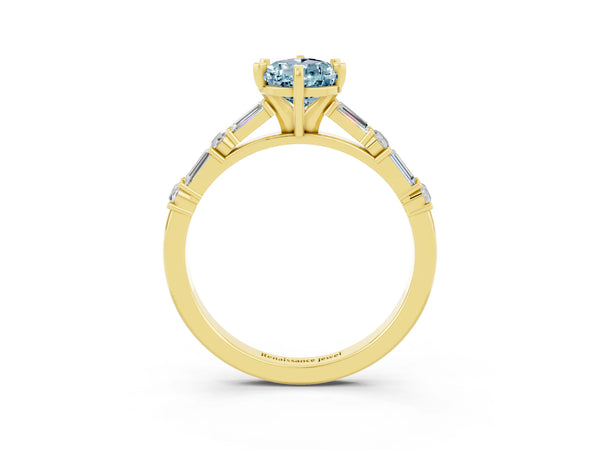 Yellow gold Pear Cut Aquamarine Solitaire with Side Baguettes and Channel Set Band