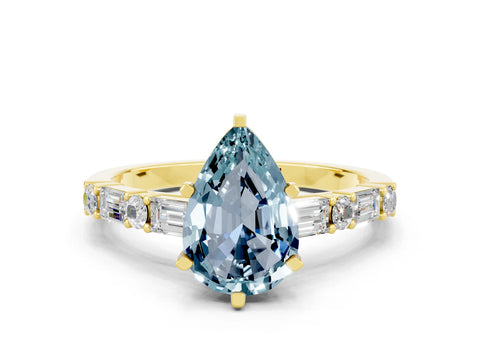 Yellow gold Pear Cut Aquamarine Solitaire with Side Baguettes and Channel Set Band