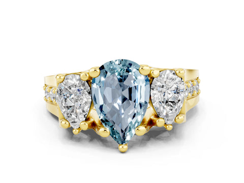 Yellow gold Pear Cut Aquamarine Three-Stone Ring with Channel Set Band and Four-Prong Setting