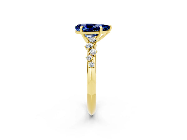 Yellow gold Pear Cut Blue Sapphire Cluster Side Stone Solitaire Ring with Prong Setting