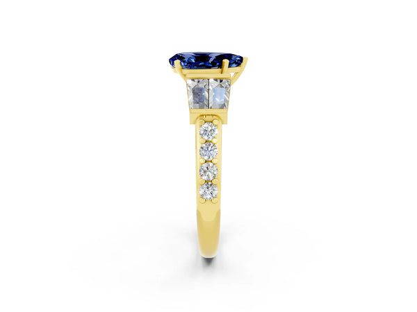 Yellow gold Pear Cut Blue Sapphire Engagement Ring with Baguette Side Stones and Channel Set Band