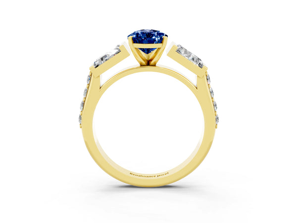 Yellow gold Pear Cut Blue Sapphire Engagement Ring with Baguette Side Stones and Channel Set Band