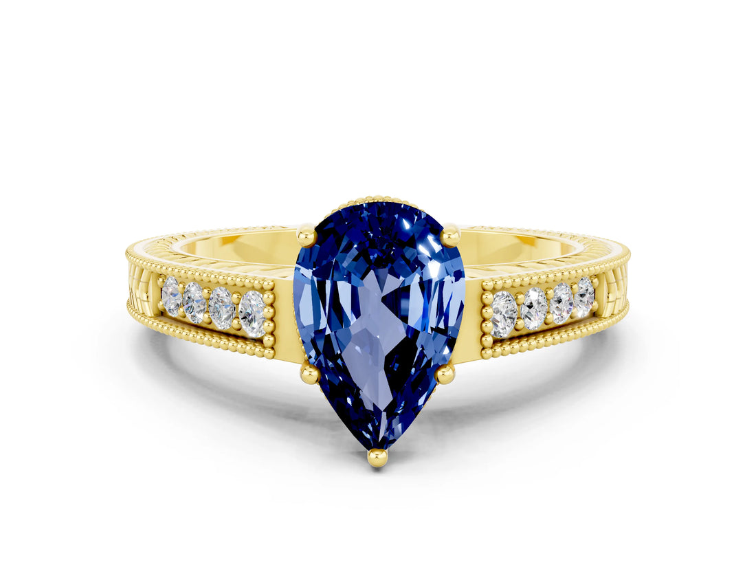 Yellow gold Pear Cut Blue Sapphire Engagement Ring with Milgrain Channel Set Band and Prong Setting