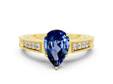Yellow gold Pear Cut Blue Sapphire Engagement Ring with Milgrain Channel Set Band and Prong Setting