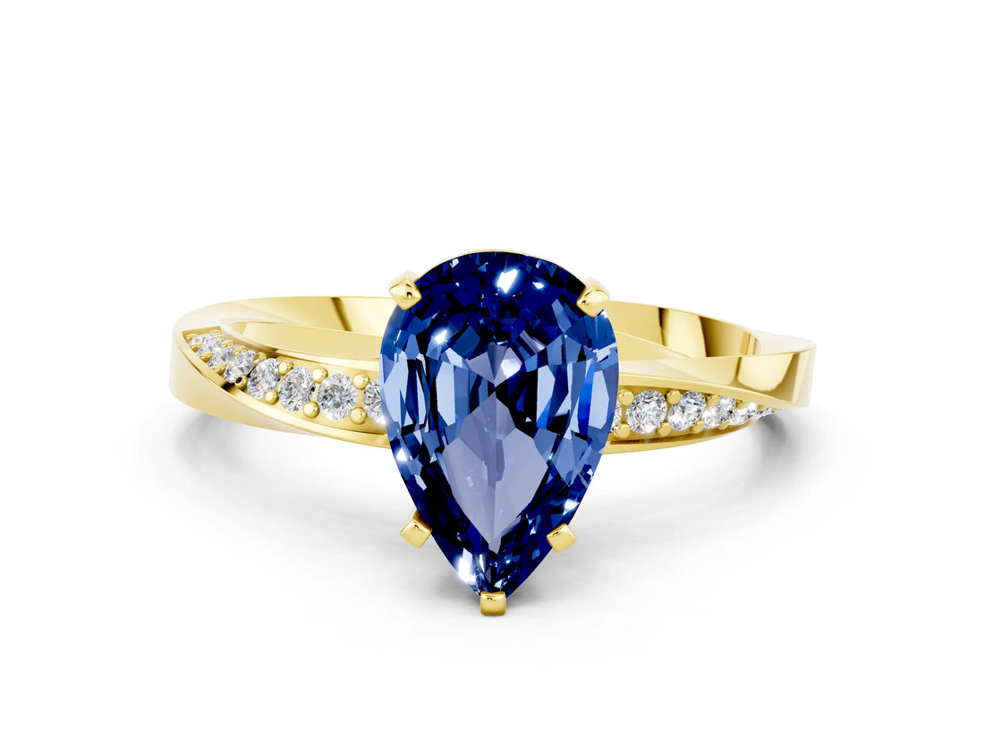 Yellow gold Pear Cut Blue Sapphire Engagement Ring with Side Stone Accents and Four-Prong Setting_60