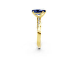 Yellow gold Pear Cut Blue Sapphire Engagement Ring with Side Stone Accents and Four-Prong Setting_62