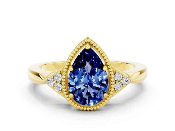 Yellow gold Pear Cut Blue Sapphire Halo Ring with Tapered Band and Four-Prong Setting