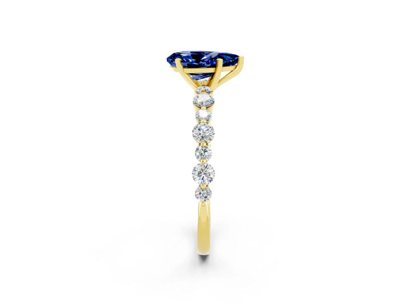 Yellow gold Pear Cut Blue Sapphire Prong Set Engagement Ring with Pavé Band