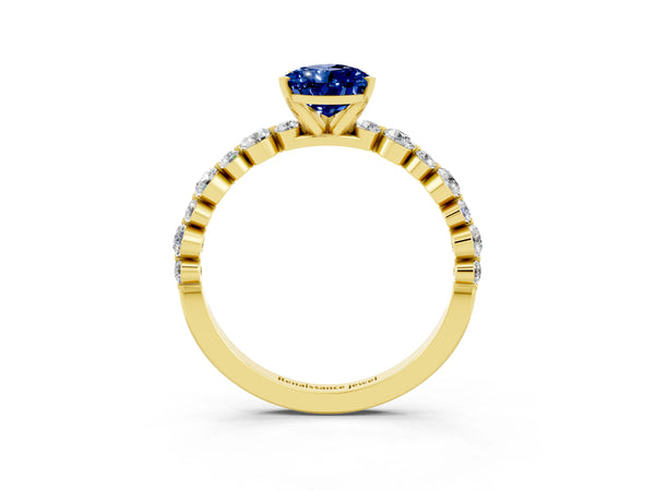 Yellow gold Pear Cut Blue Sapphire Prong Set Engagement Ring with Pavé Band