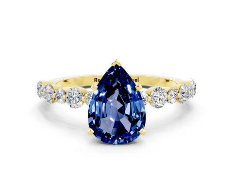Yellow gold Pear Cut Blue Sapphire Prong Set Engagement Ring with Pavé Band