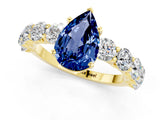 Yellow gold Pear Cut Blue Sapphire Prong Setting with Side Stones on a Pave Band_1