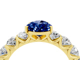 Yellow gold Pear Cut Blue Sapphire Prong Setting with Side Stones on a Pave Band_4
