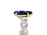 Yellow gold Pear Cut Blue Sapphire Prong Setting with Side Stones on a Pave Band_5