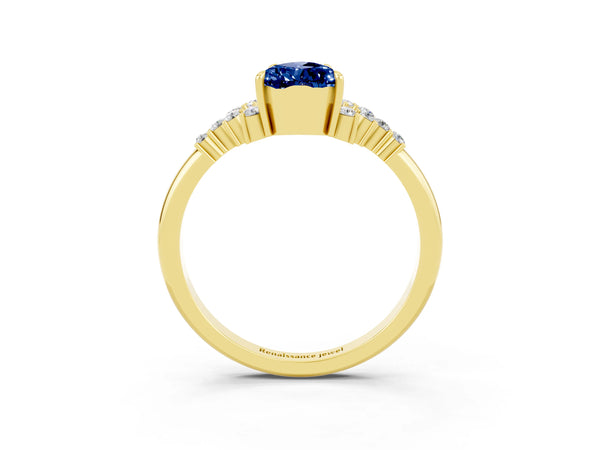 Yellow gold Pear Cut Blue Sapphire Ring with Side Stones and Four-Prong Setting