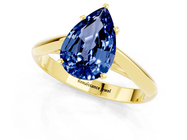 Yellow gold Pear Cut Blue Sapphire Solitaire Engagement Ring with Cathedral Setting and Four-Prong Mount