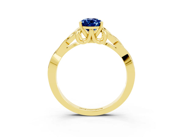 Yellow gold Pear Cut Blue Sapphire Solitaire Engagement Ring with Celtic Knot Band and Four-Prong Setting