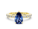 Yellow gold Pear Cut Blue Sapphire Solitaire Engagement Ring with Pavé Band and Four-Prong Setting