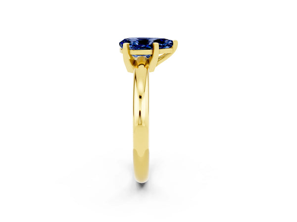Yellow gold Pear Cut Blue Sapphire Solitaire Engagement Ring with Round Band and Four-Prong Setting