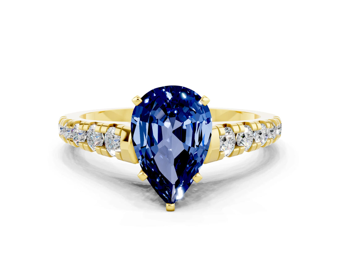 Yellow gold Pear Cut Blue Sapphire Solitaire Ring with Cathedral Setting and Pavé Band