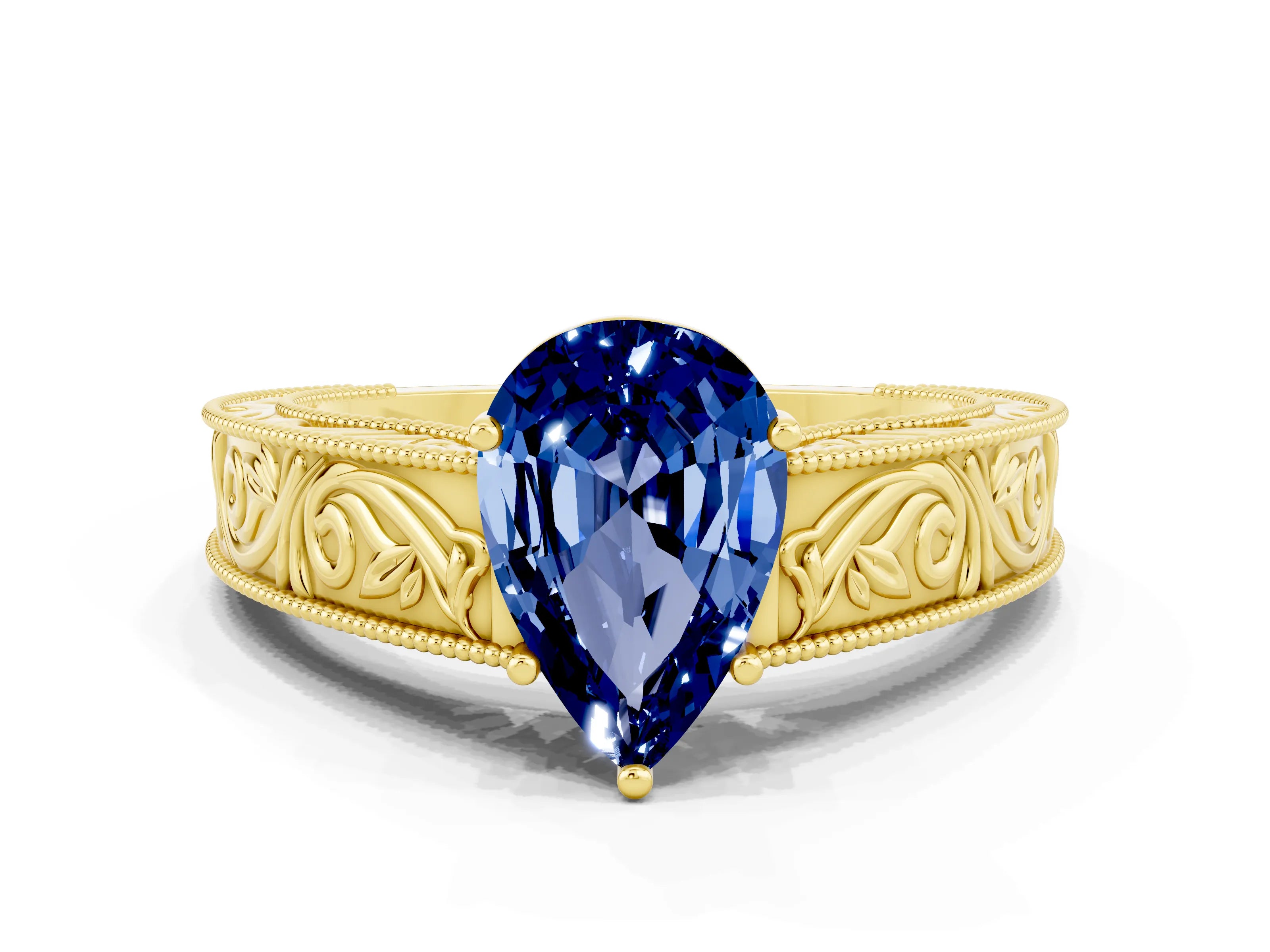 Yellow gold Pear Cut Blue Sapphire Solitaire Ring with Engraved Band and Four-Prong Setting