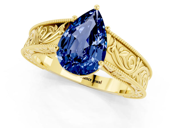 Yellow gold Pear Cut Blue Sapphire Solitaire Ring with Engraved Band and Four-Prong Setting