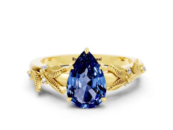 Yellow gold Pear Cut Blue Sapphire Solitaire Ring with Leaf Motif Band and Four-Prong Setting