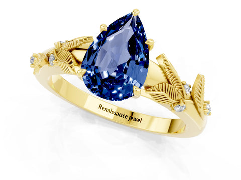 Yellow gold Pear Cut Blue Sapphire Solitaire Ring with Leaf Motif Band and Four-Prong Setting_1