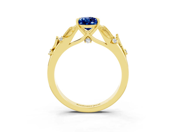 Yellow gold Pear Cut Blue Sapphire Solitaire Ring with Leaf Motif Band and Four-Prong Setting