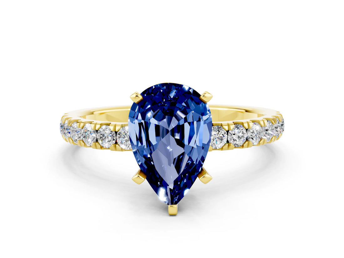 Yellow gold Pear Cut Blue Sapphire Solitaire Ring with Pavé Accents and Four-Prong Setting