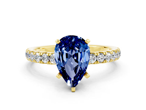 Yellow gold Pear Cut Blue Sapphire Solitaire Ring with Pavé Accents and Four-Prong Setting