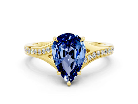 Yellow gold Pear Cut Blue Sapphire Solitaire Ring with Pavé Band and Prong Setting