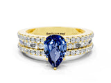 Yellow gold Pear Cut Blue Sapphire Solitaire Ring with Pavé and Channel Set Band