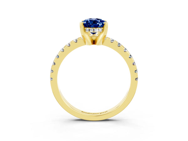 Yellow gold Pear Cut Blue Sapphire Solitaire Ring with Round Pavé Band and Four-Prong Setting